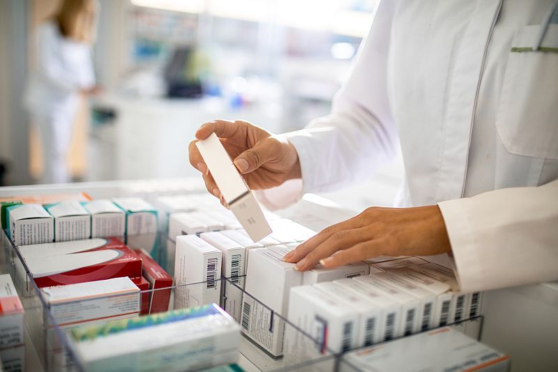 pharmacist organizing the medicine drawer